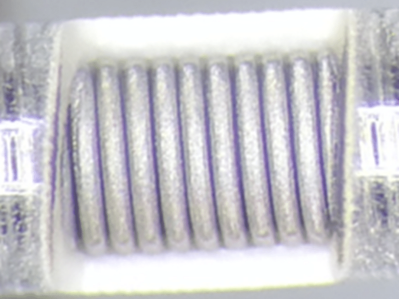 femtosecond surgical device exposure of torque spring